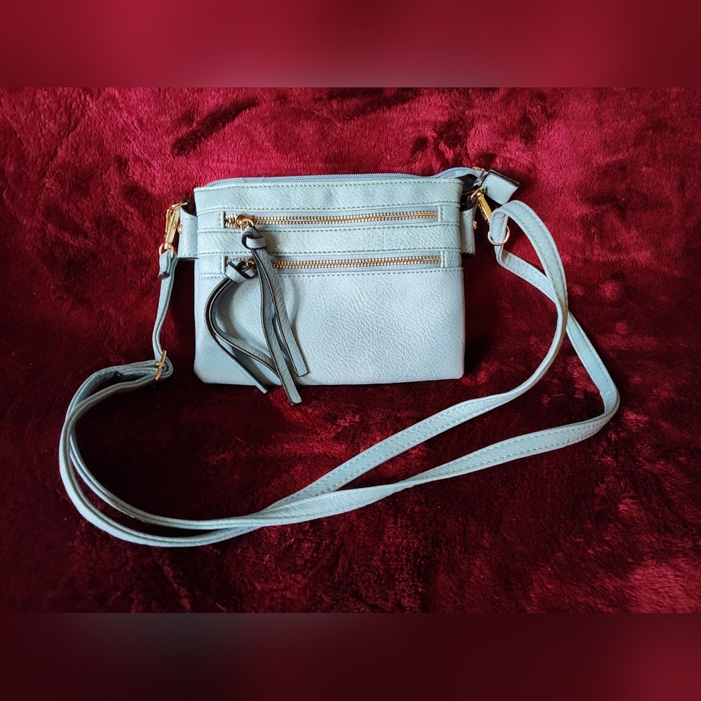 Baby blue purse with tassels multiple pockets layers zippers